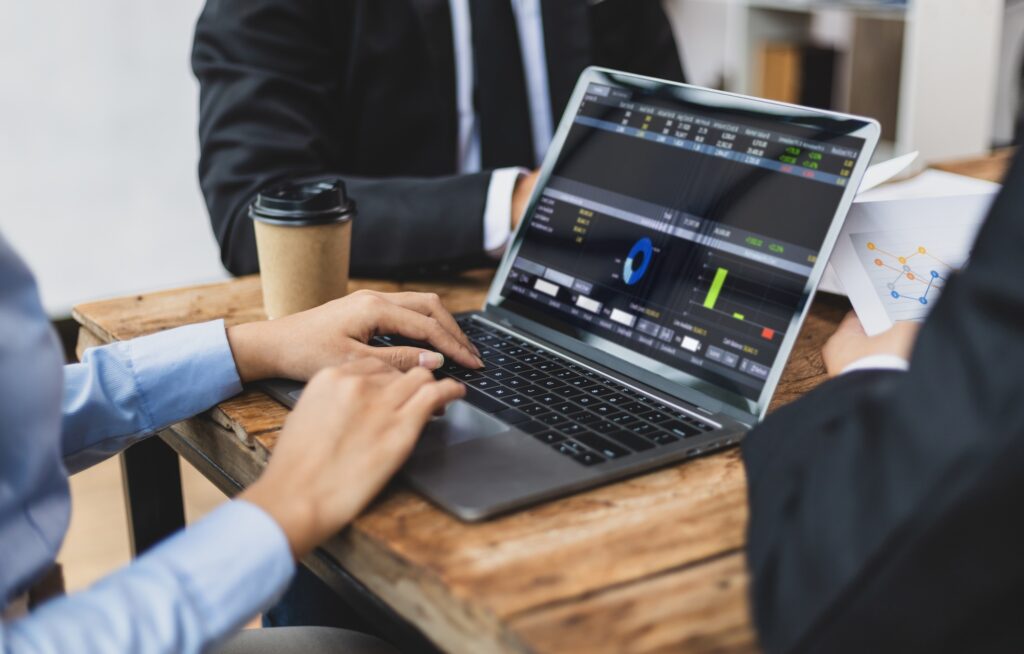 Meeting of business consultants analyzing financial chart.